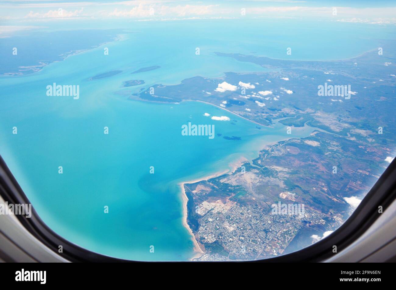 Aerial view of the seacoast from window of the airplane Stock Photo