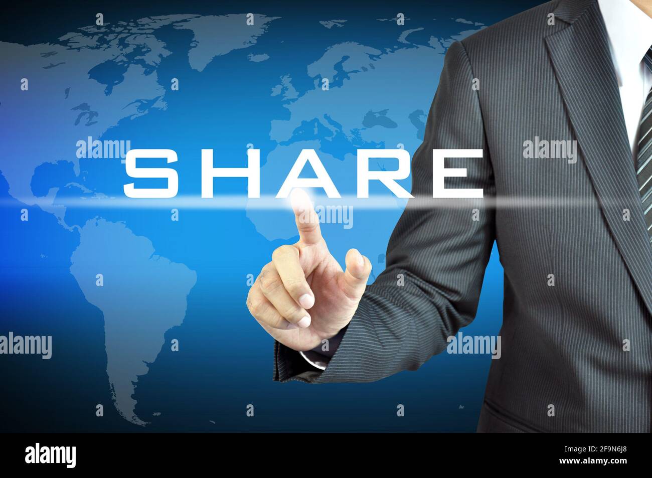 Businessman hand touching SHARE word on virtual screen - online business & marketing concept Stock Photo
