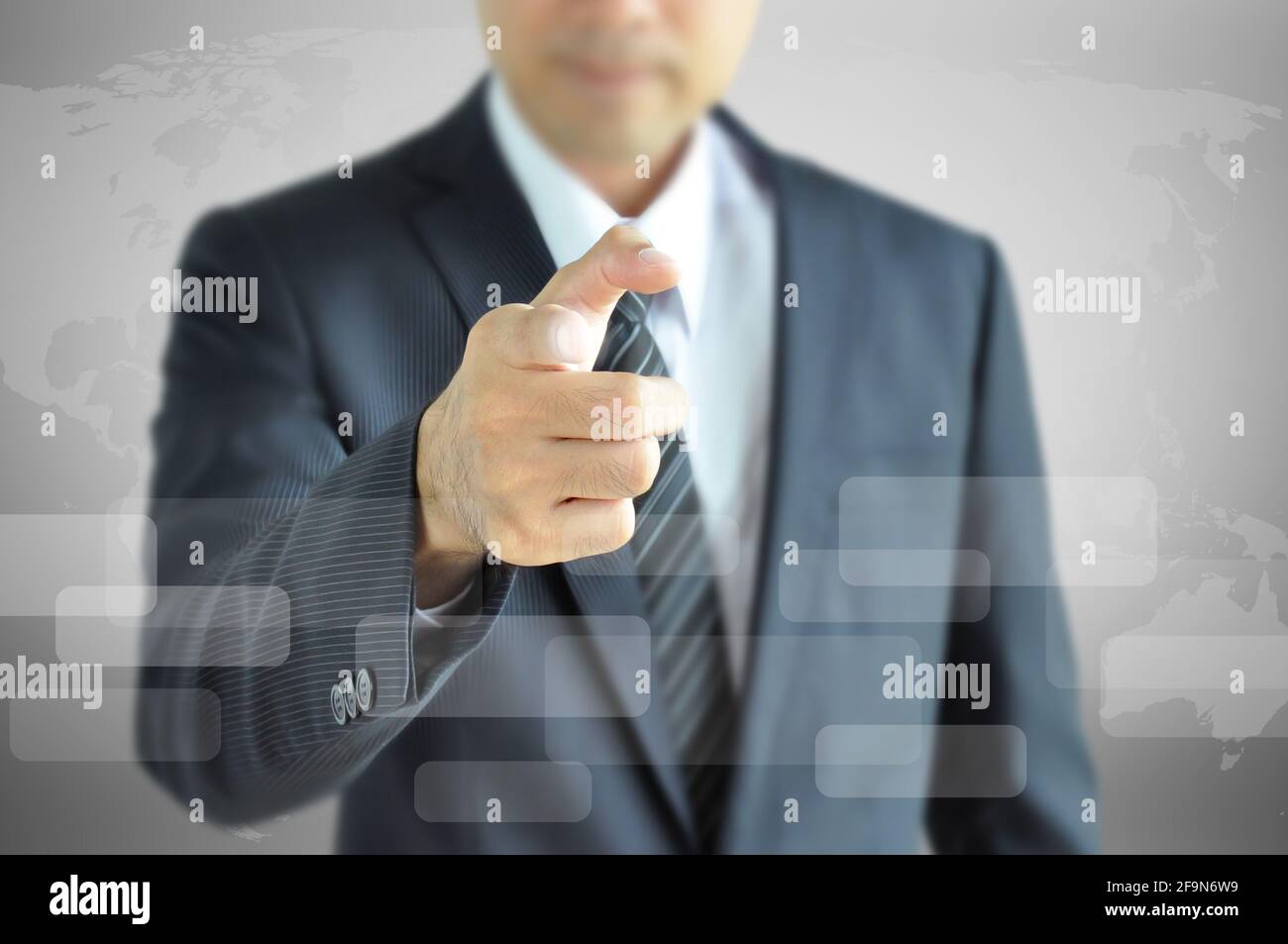Businessman pointing finger at you Stock Photo