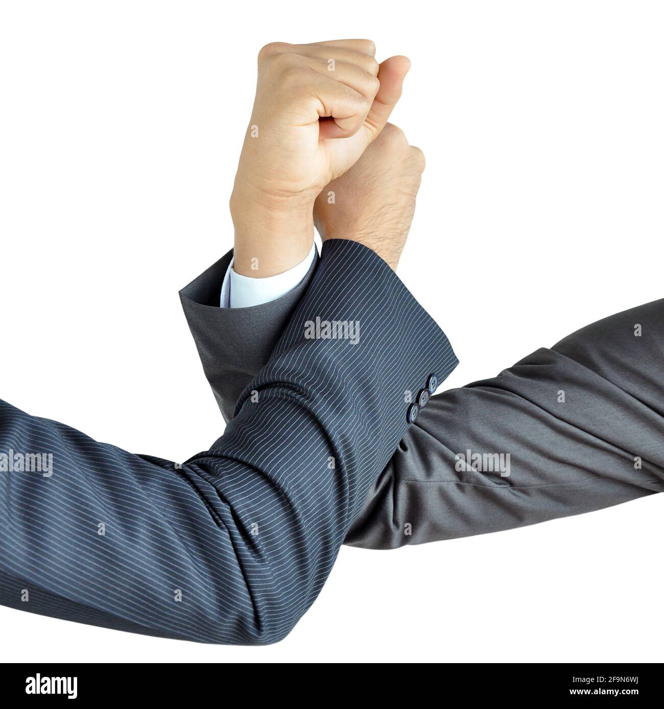Businessman hands engage in arm wrestling Stock Photo