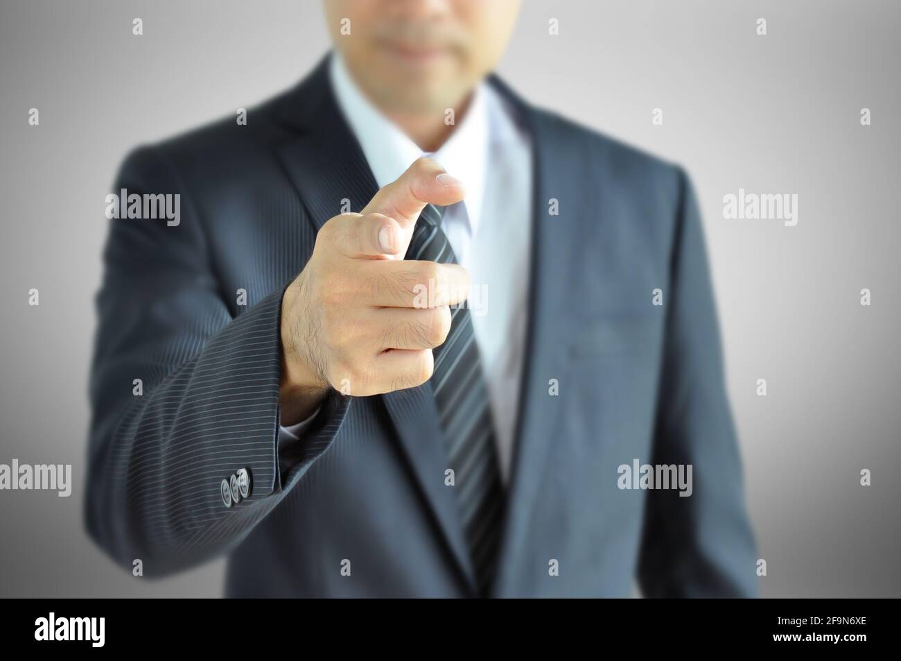 Businessman pointing finger at you Stock Photo