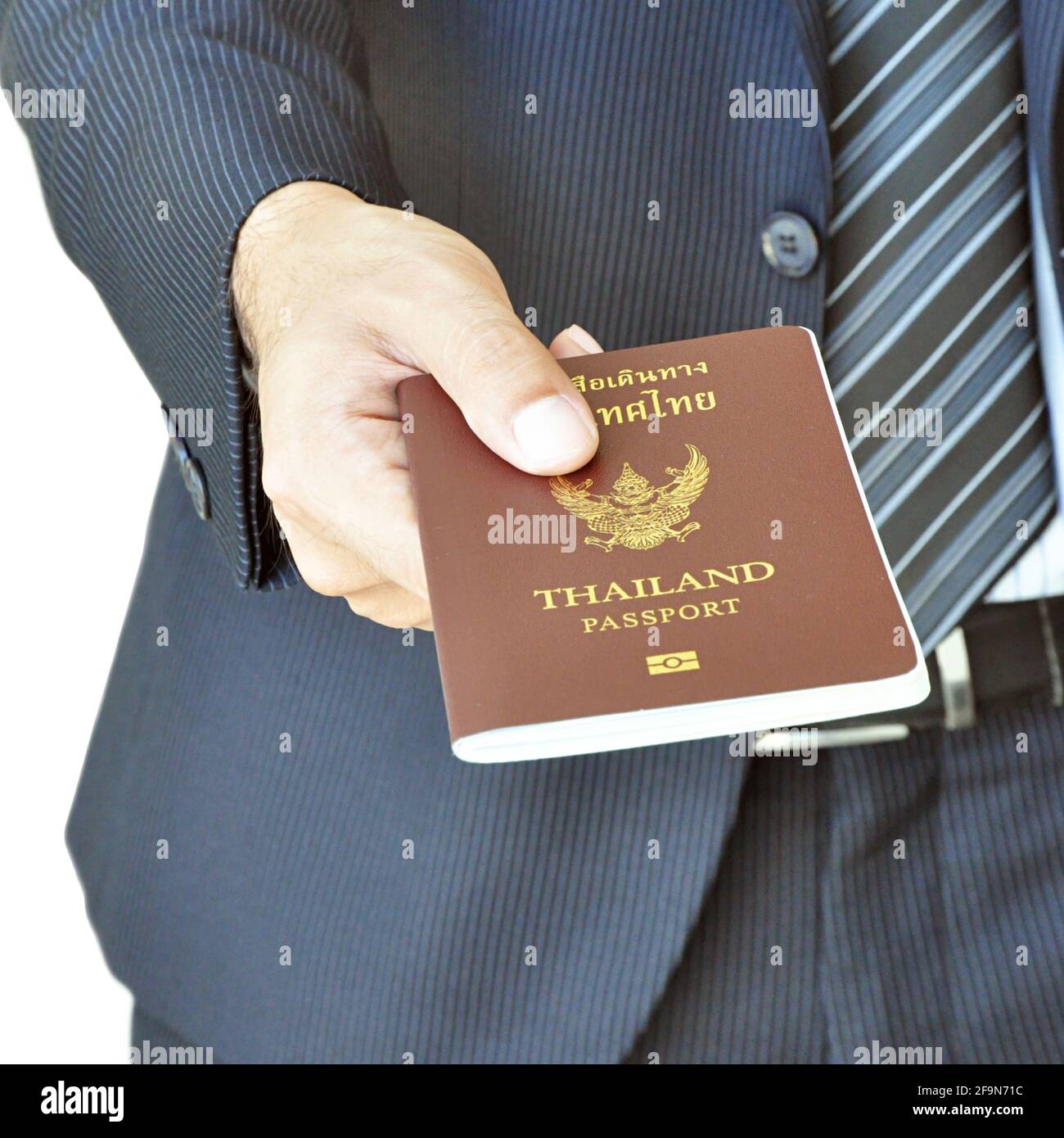 Businessman hand giving passport Stock Photo Alamy