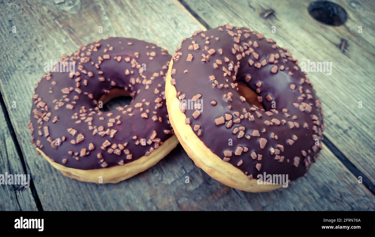 chocolate donuts on a wooden background Stock Photo