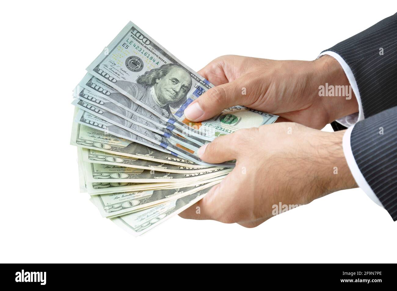 Money - hands holding banknotes  (United States Dollars or USD) on white background Stock Photo
