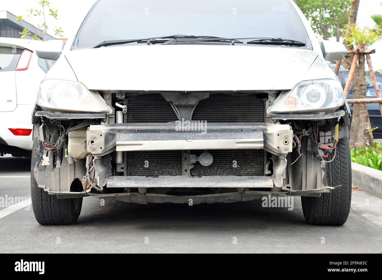 Damaged car with no grille and front bumper Stock Photo Alamy