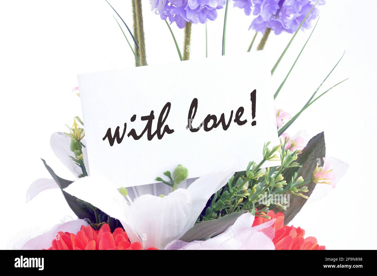 Flower bouquet and ' with love ' on  tag card - retro style lighting effect Stock Photo
