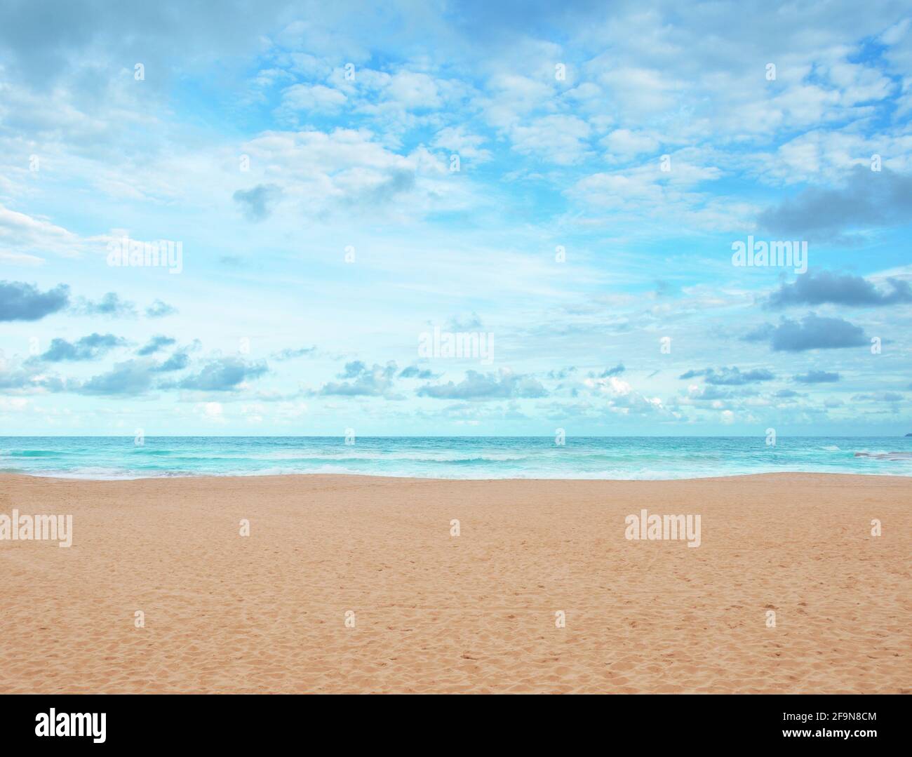 Sand beach and blue sky Stock Photo - Alamy