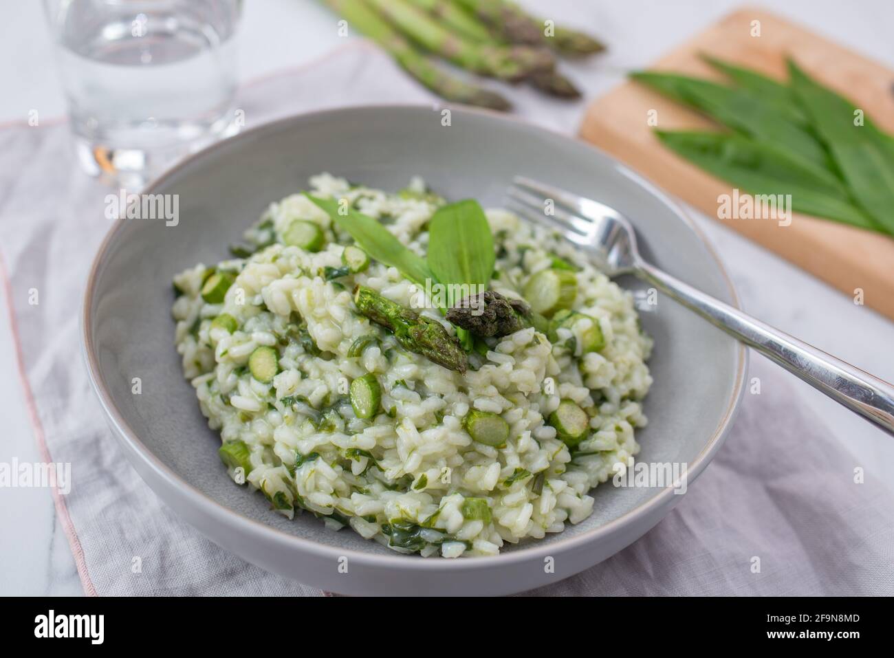 Spring food; Delicious risotto with asparagus and wild garlic Stock ...