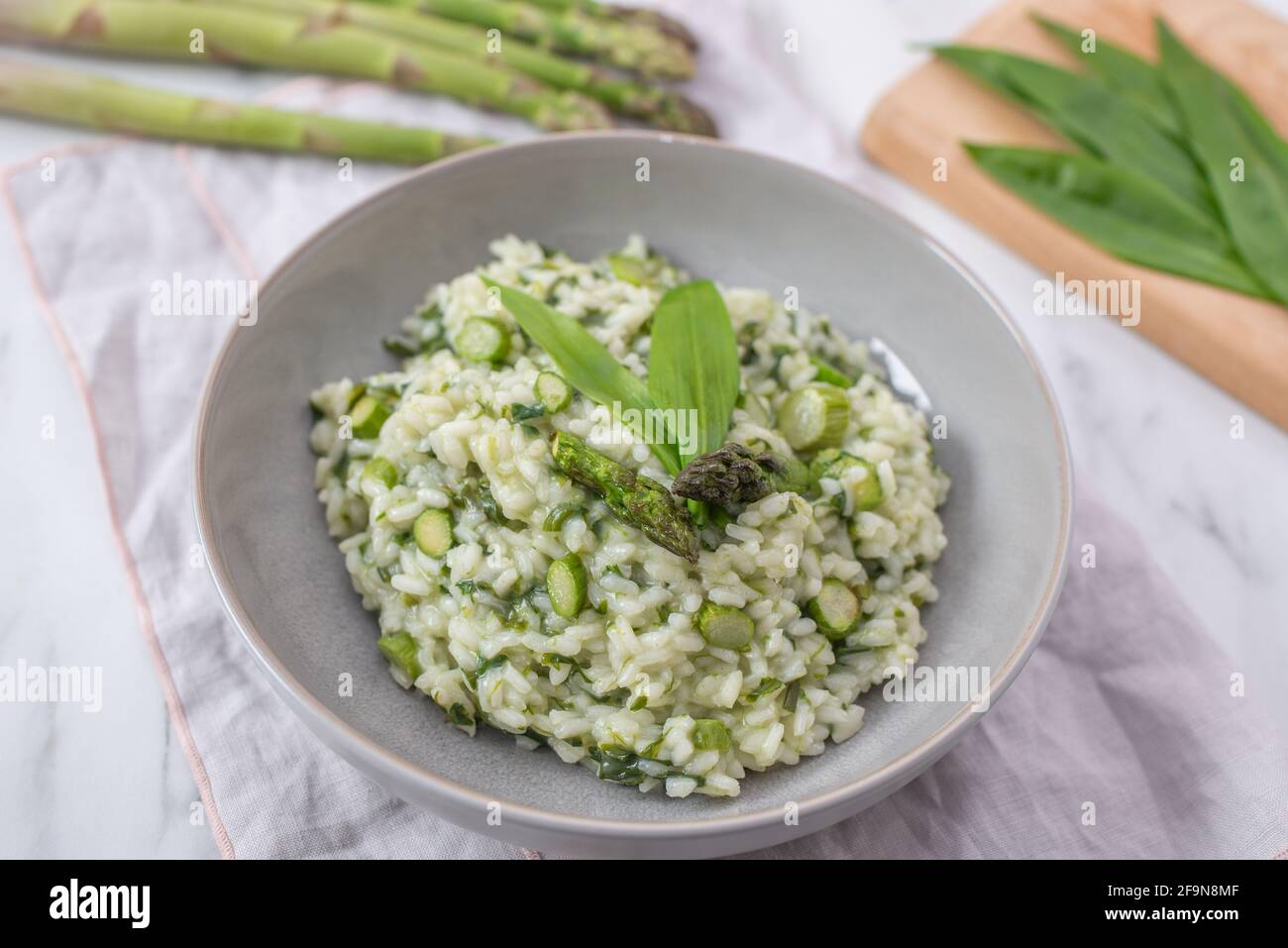 Spring food; Delicious risotto with asparagus and wild garlic Stock ...