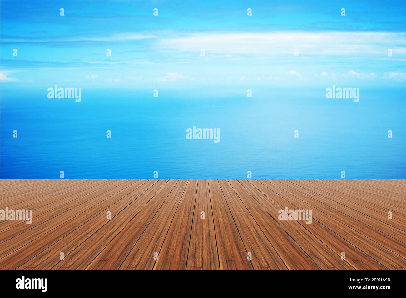 Wood plank on still blue sea water & sky background Stock Photo