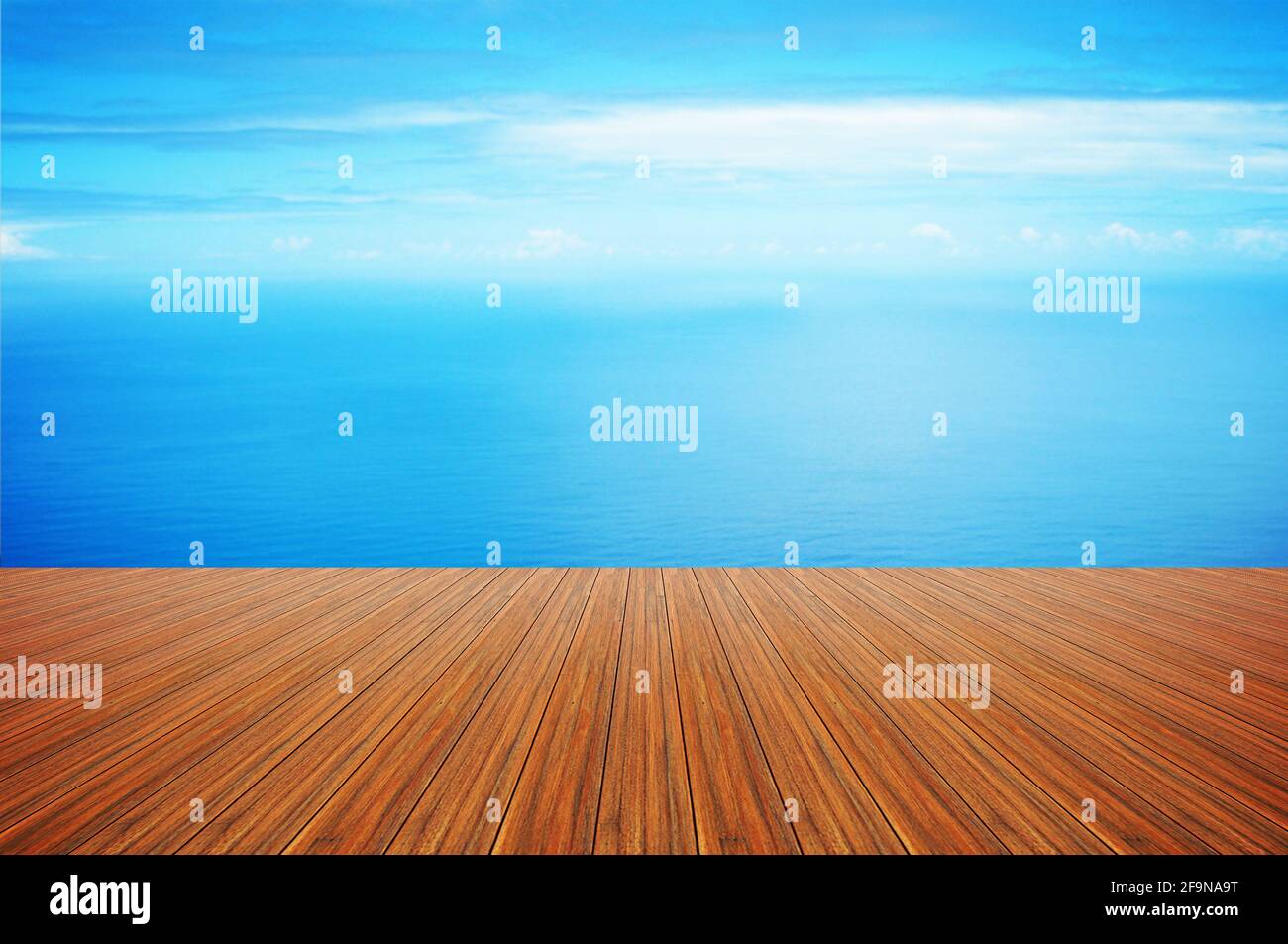 Wood plank on still blue sea water & sky background Stock Photo