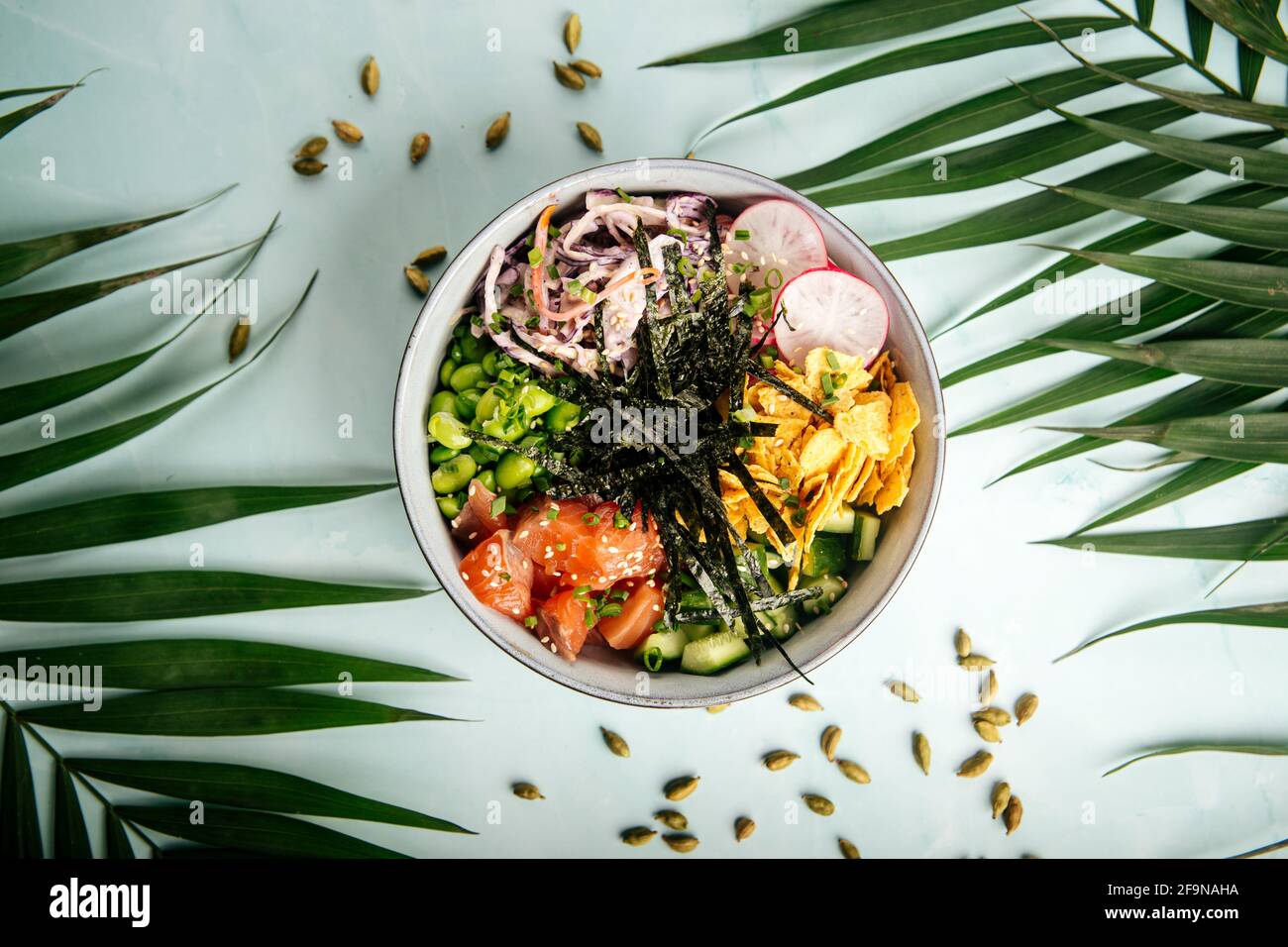 Hawaiian salmon poke bowl with rice and vegetables Stock Photo - Alamy
