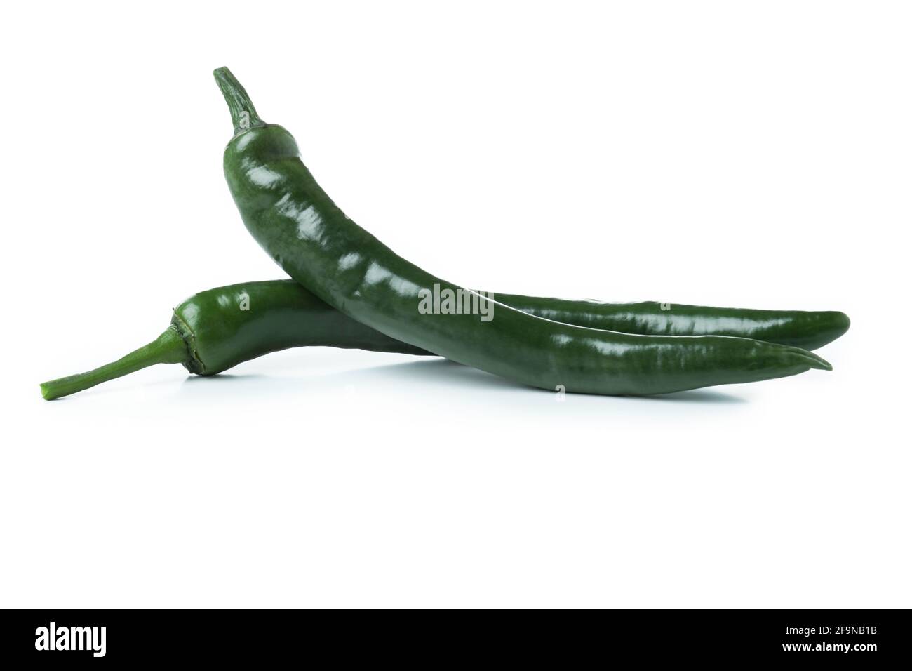 Green chili peppers isolated on white background Stock Photo - Alamy