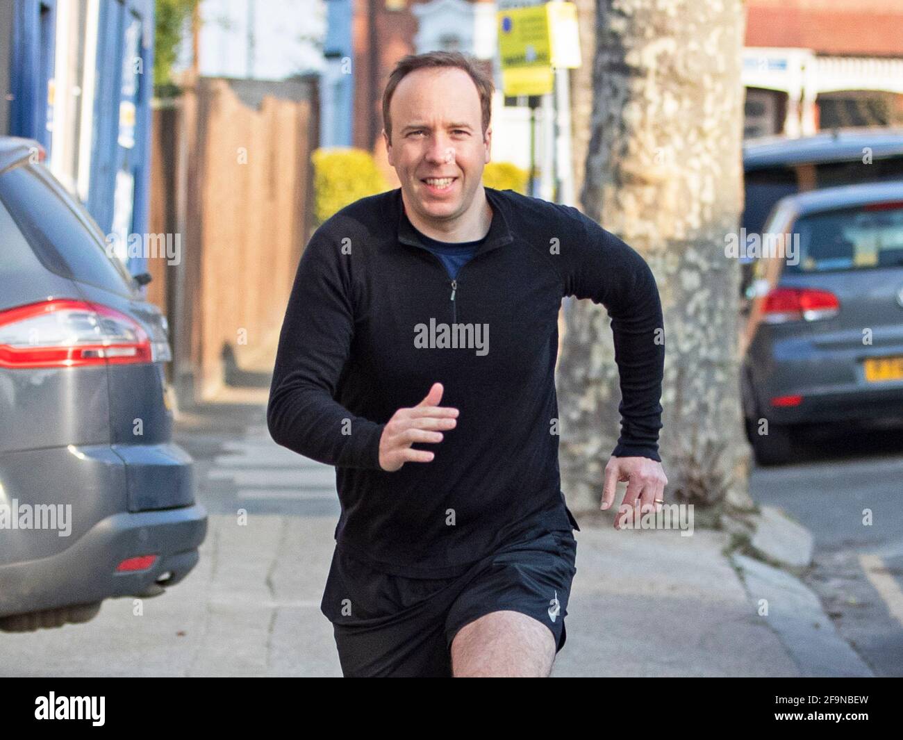 Health Secretary Matt Hancock sets off on a jog this morning near his West London home on the 20th of April 2020 as he revealed yesterday that India h Stock Photo