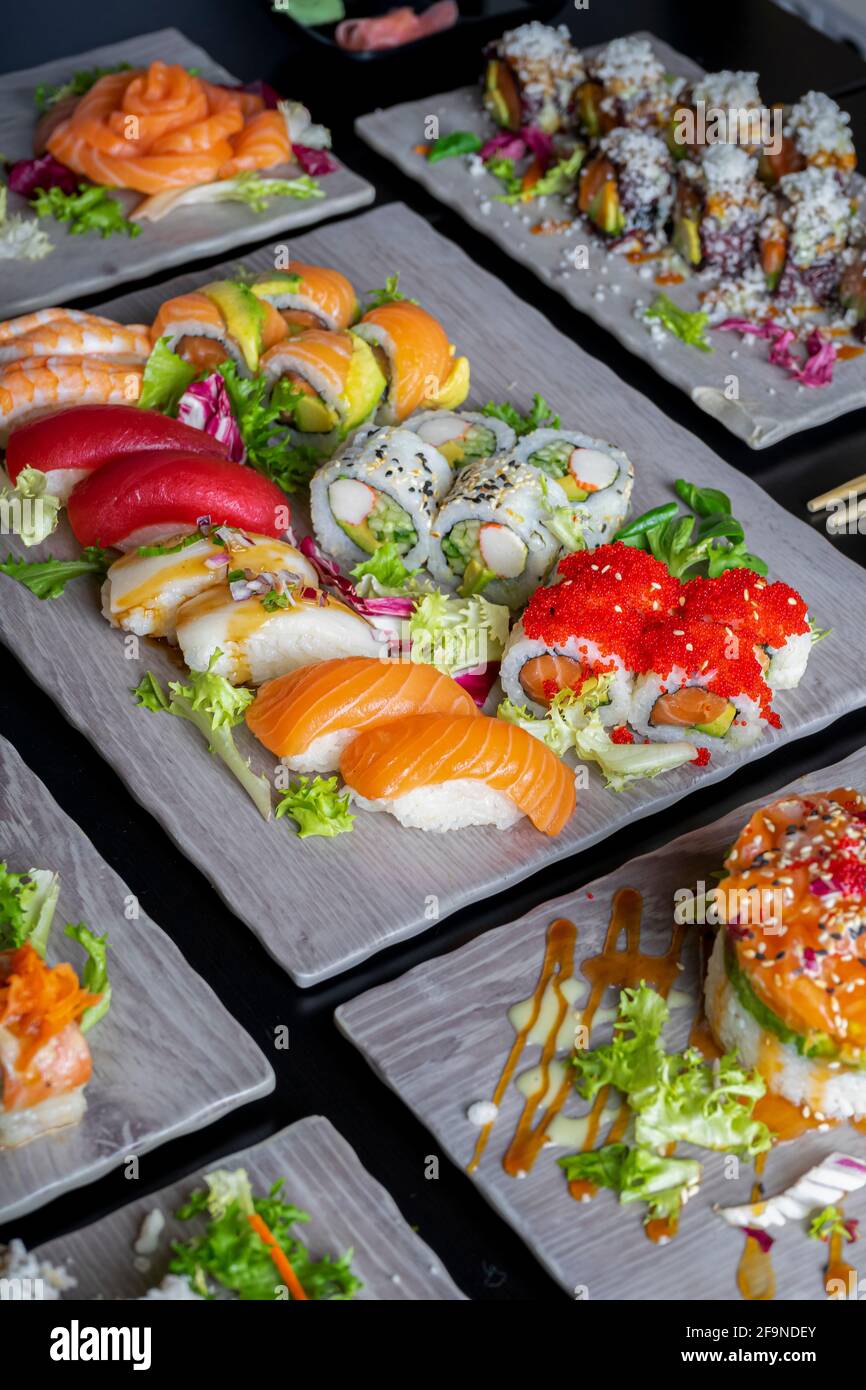 Top view of variety of Japanese dishes on dark background. Vertical image Stock Photo