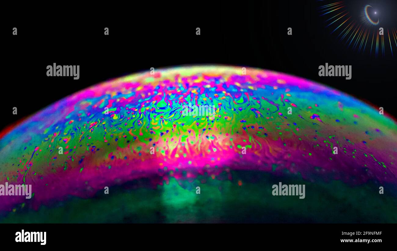 A colorful soap bubble in a macro photography perspective in the