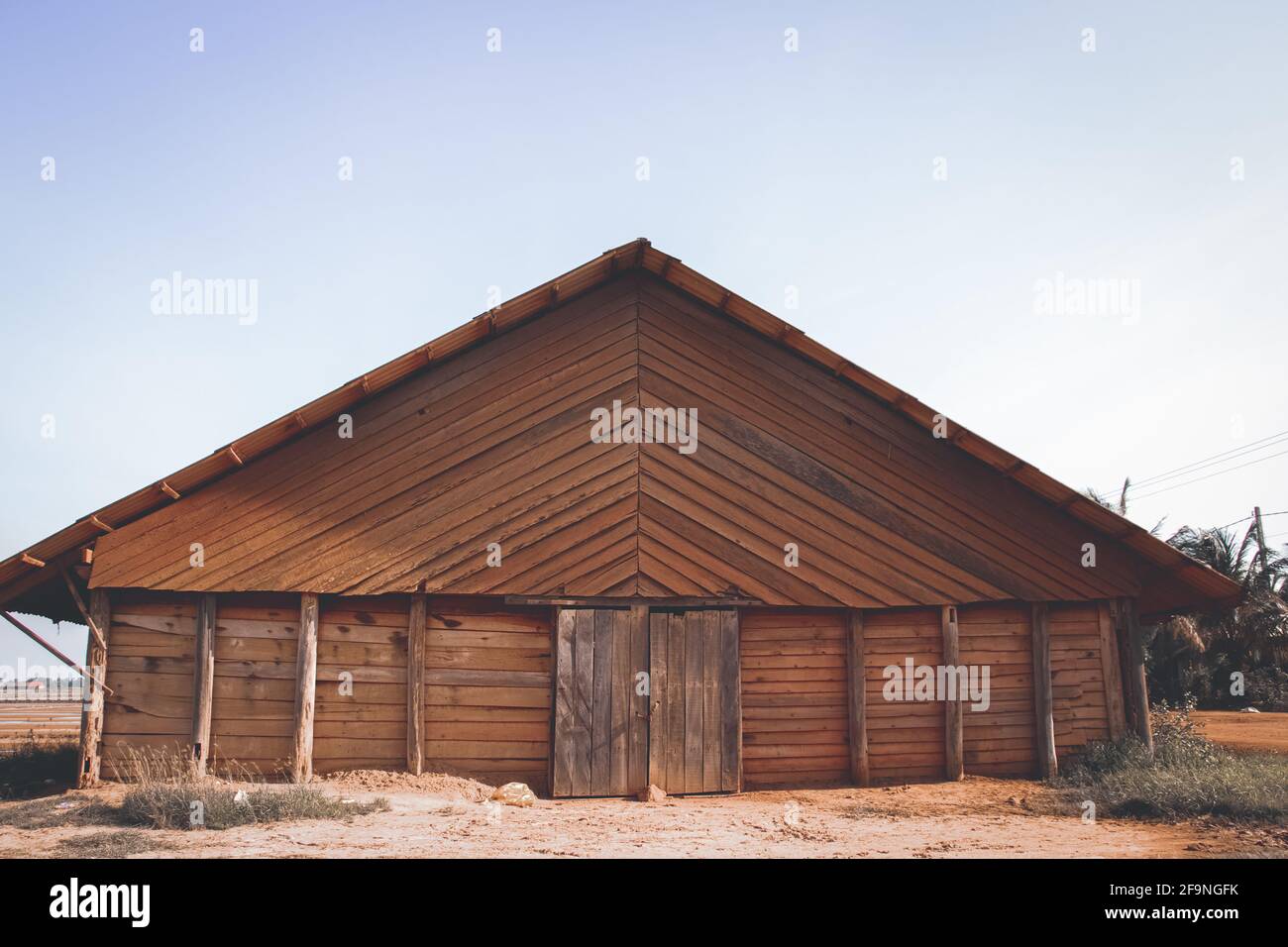 Beautiful view of an old wooden house against a blue sky Stock Photo ...