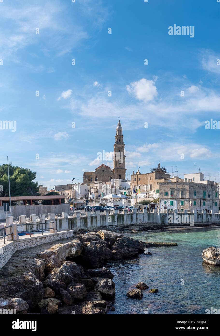 Monopoli harbor in the Metropolitan City of Bari and region of Apulia (Puglia), Italy and the Basilica Concattedrale Maria Santissima della Madia. Stock Photo