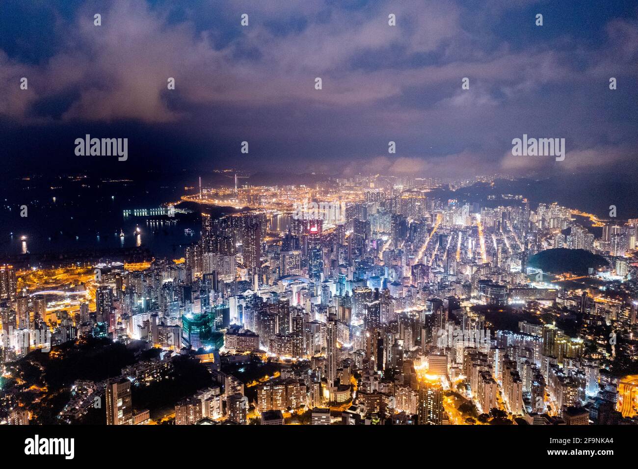 Epic aerial view of night scene of Victoria Harbour, Hong Kong, famous