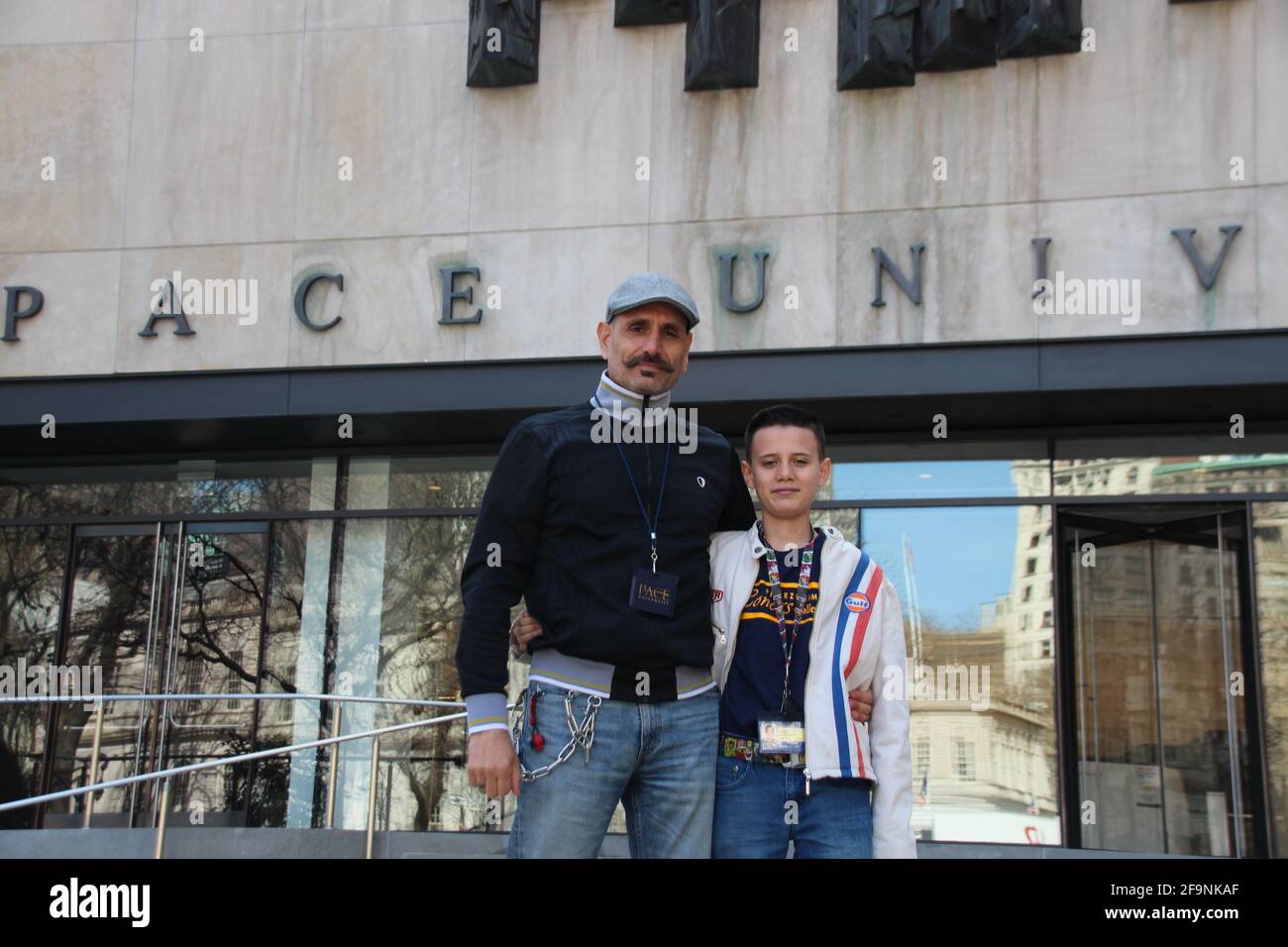 New York, USA. 23rd Mar, 2021. Bardia Gharib (l) stands proudly with his son Shahab Gharib in front of the entrance to Pace University. The 13-year-old, who was born in Bruchsal, Baden-Württemberg, and moved to Florida with his parents as a toddler, has been studying at New York's renowned Pace University since this spring - as one of the youngest students in the history of the educational institution. Credit: Christina Horsten/dpa/Alamy Live News Stock Photo