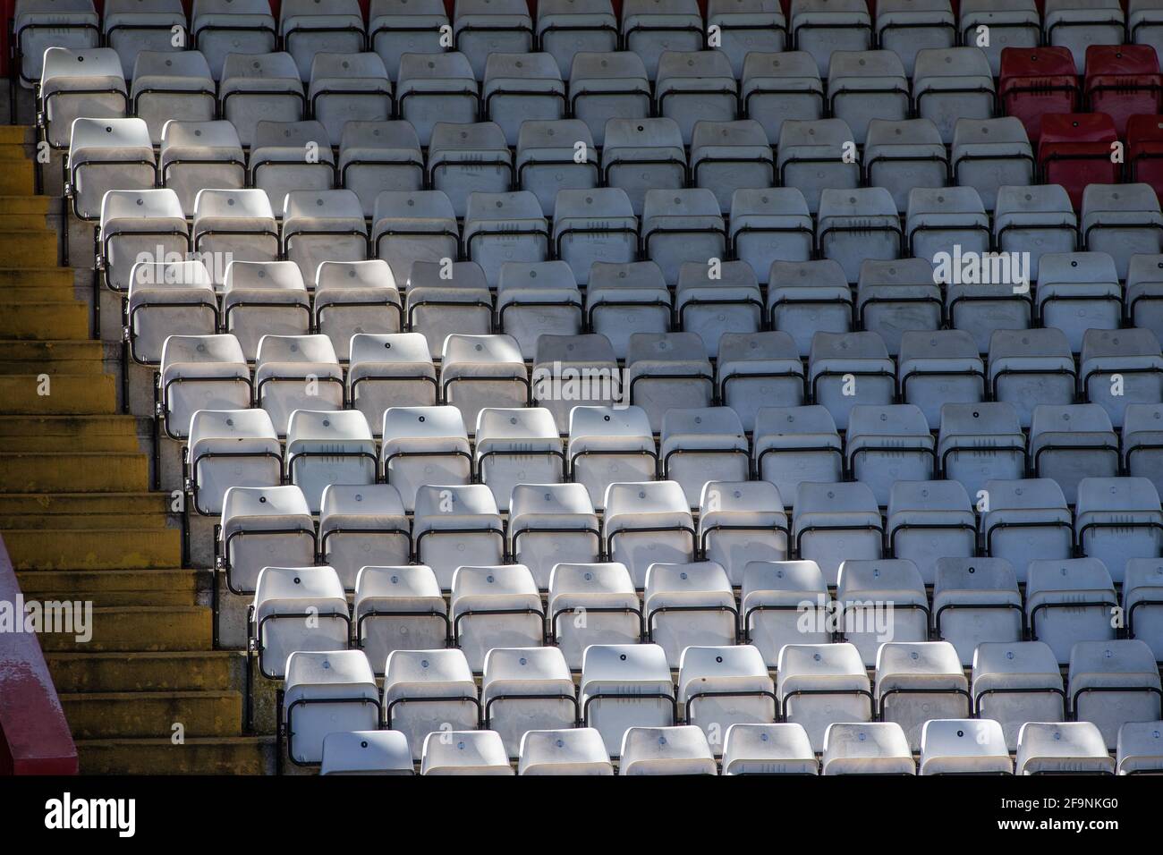 Empty seats at lower league football stadium in England, UK Stock Photo