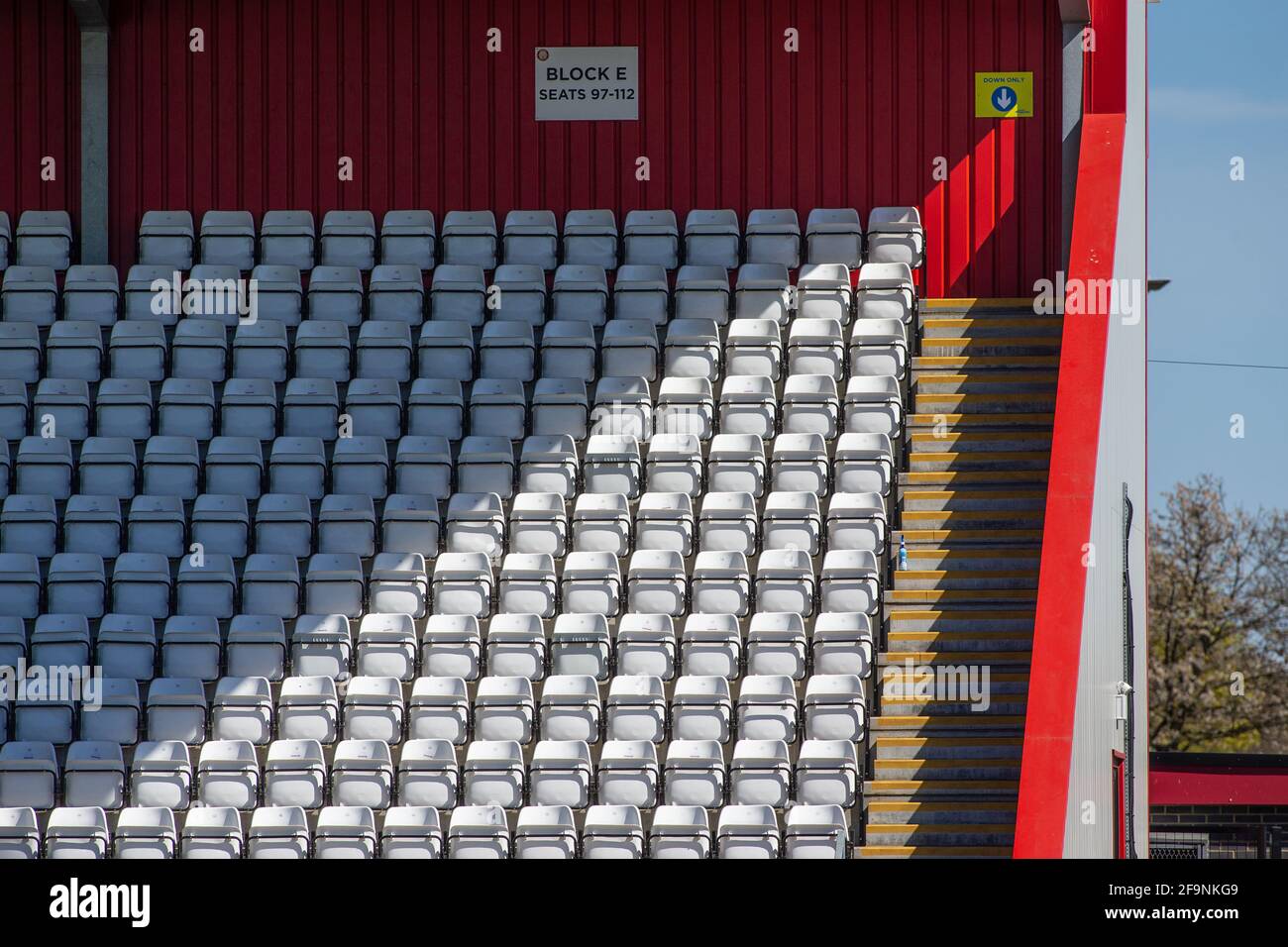 Empty seats at lower league football stadium in England, UK Stock Photo