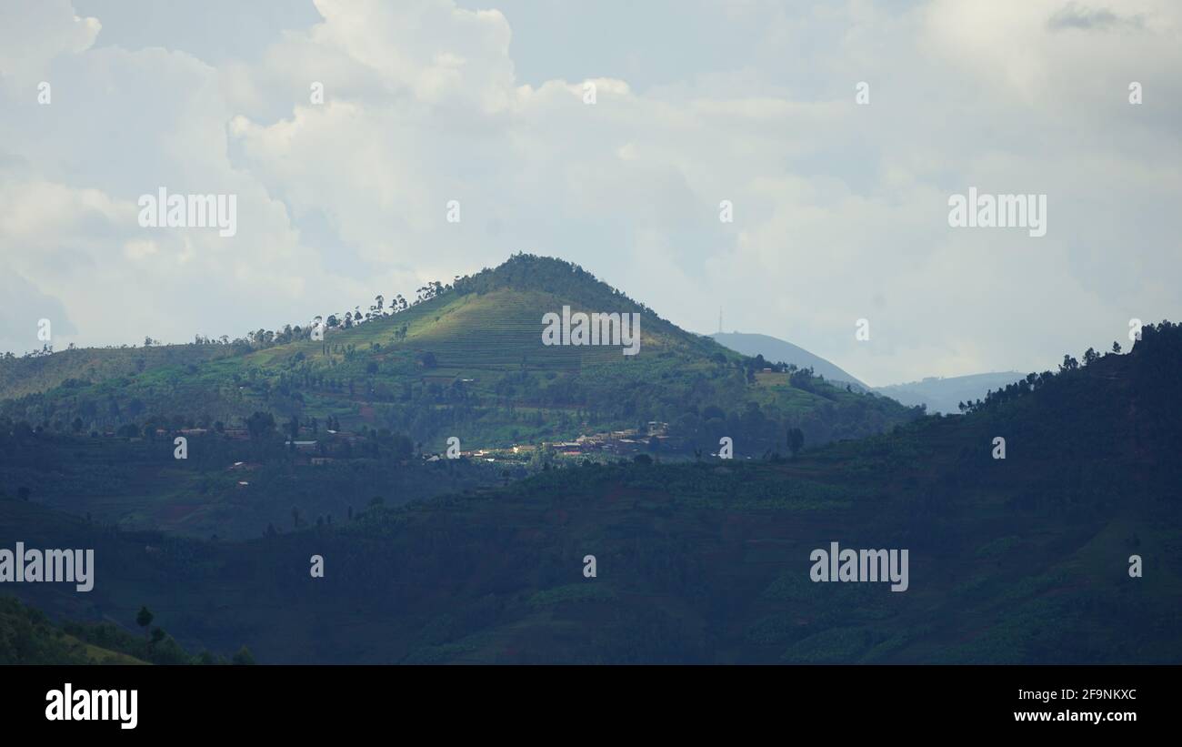 mountains of Africa-Rwanda. this country is known as a country of 1000 hills with blue sky and white clouds Stock Photo