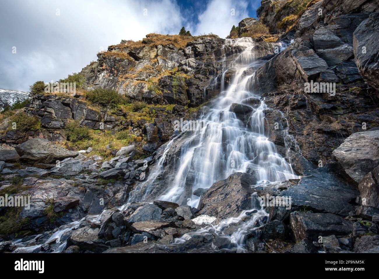 Balea Cascada waterfall in Fagaras mountains near famous Transfagarasan road. Rocky waterfall in the Carpathians, Transylvania, Romania. Stock Photo