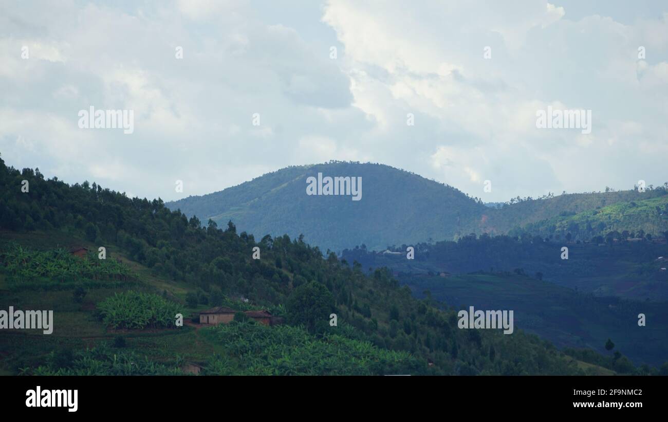 mountains of Africa-Rwanda. this country is known as a country of 1000 hills with blue sky and white clouds Stock Photo