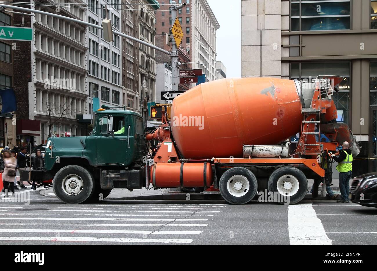 A green-orange concrete mixer truck working on street of Manhattan. New  York. USA Stock Photo - Alamy