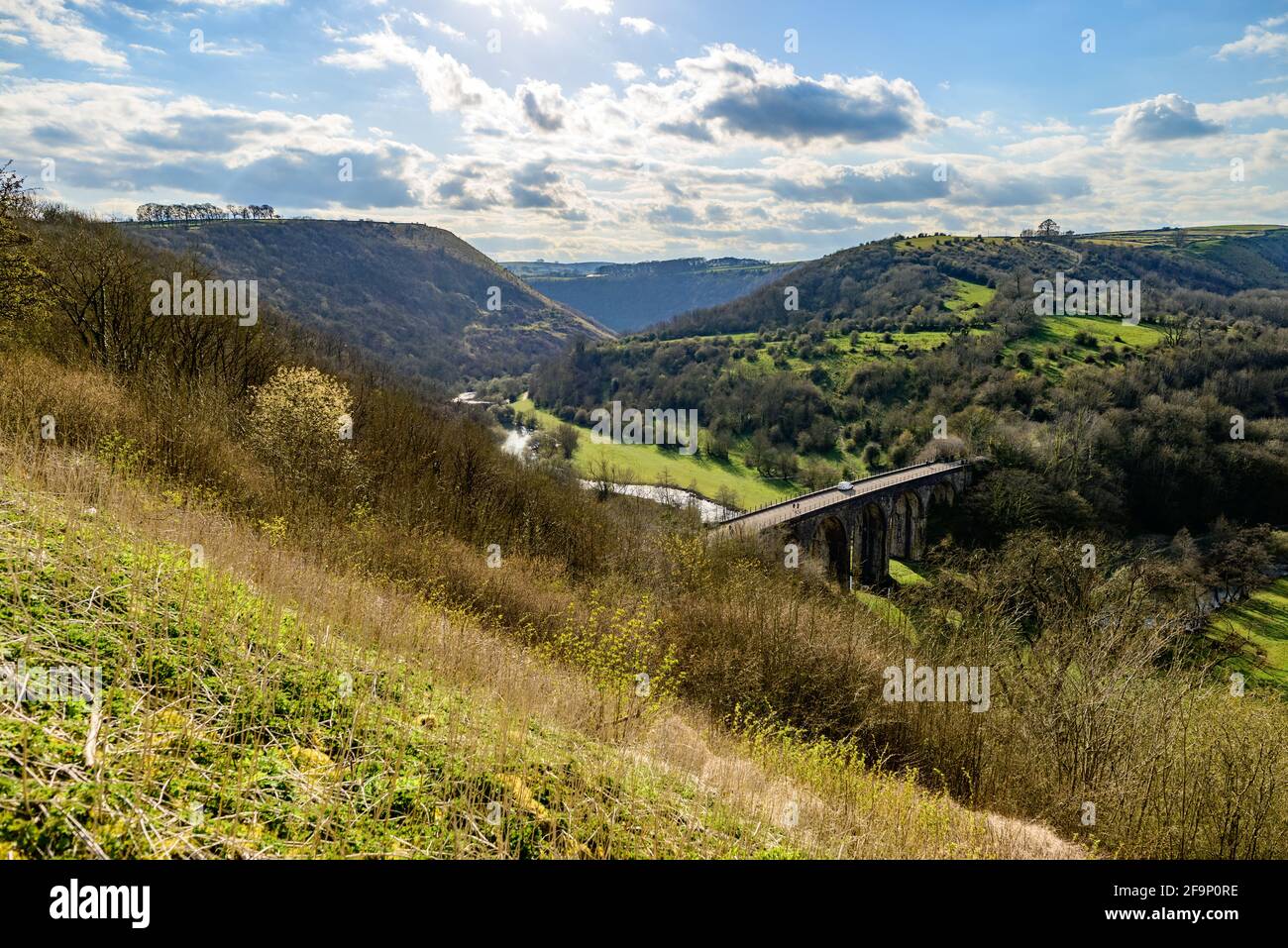 Monsal Head, Peak District, Derbyshire, UK. The Monsal Trail passes over the disused railway viaduct in the Wye valley below. Stock Photo