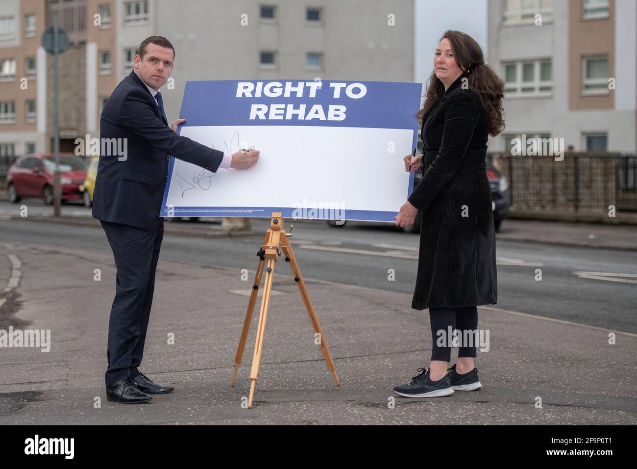 Glasgow, Scotland, UK. 20 April 2021. PICTURED: (left) Douglas Ross MP, Scottish Conservative and Unionist Party Leader, (right) Annemarie Ward, Advocacy Activist for those suffering and recovering from addiction and CEO of FAVORUK. Scottish Conservative leader Douglas Ross said: “For too long, the government has taken its eye off the ball, by its own admission. Tackling drug deaths has not been a priority and that has to change now. Too many lives have already been lost. Recovery experts have raised the alarm that Scotland's drug deaths figures “undoubtedly will rise” as people still cannot Stock Photo