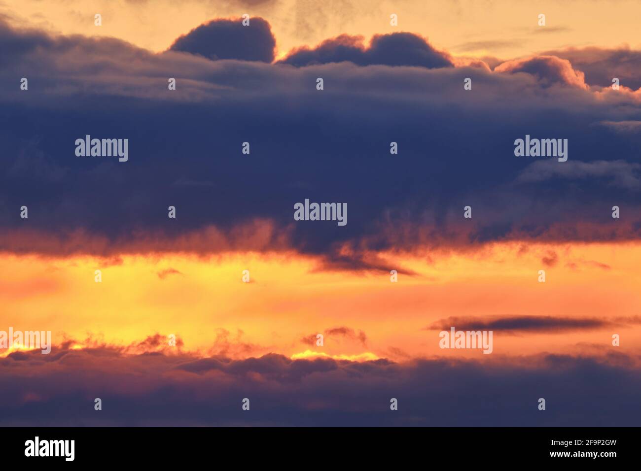Dark clouds in the orange evening sky, sunset background Stock Photo ...