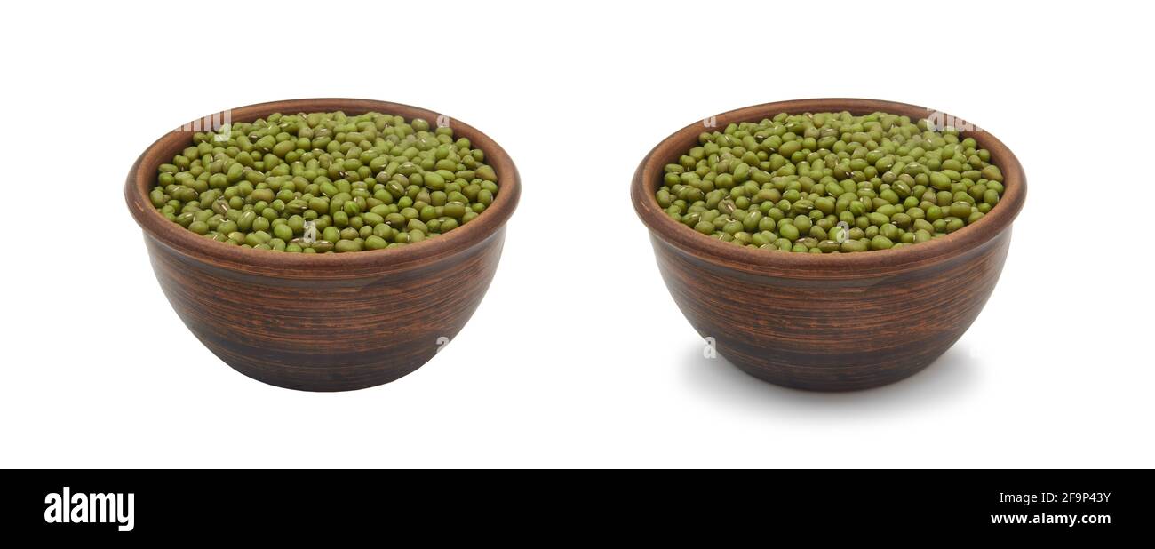 mung beans in simple clay bowl on white background, isolated and with shadow Stock Photo