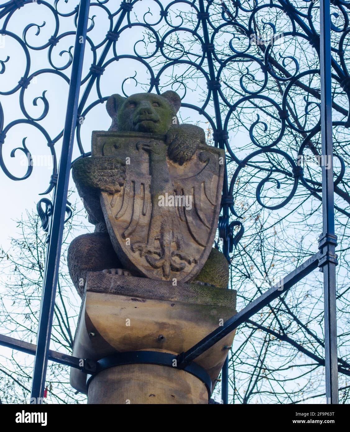 statue of a bear locked in a cage holding coat of arms of berlin Stock