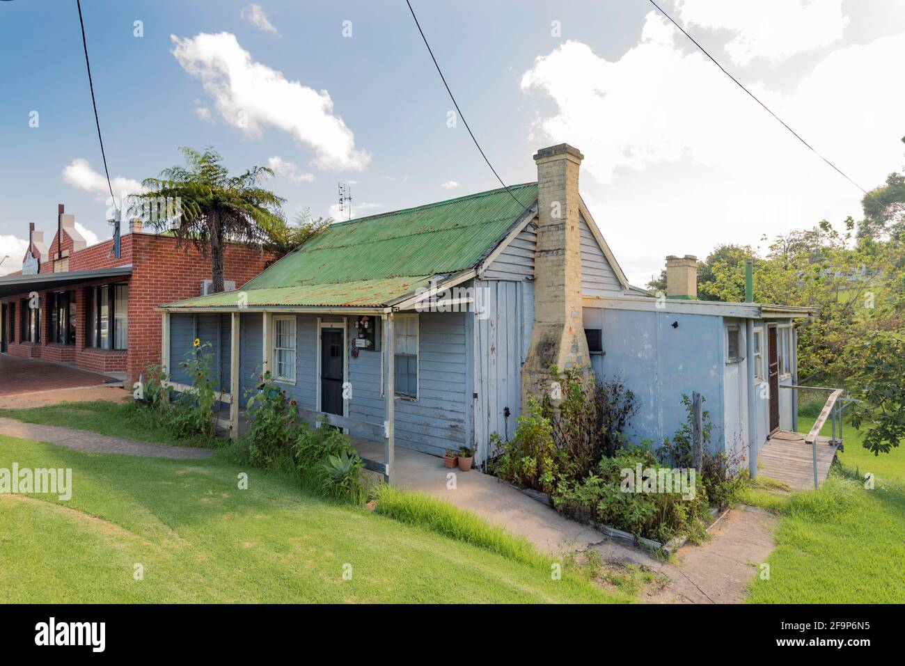 Victorian era timber weatherboard and corrugated iron roof cottage built in the 1880's. It is representative of homes in the Pambula area of the time Stock Photo