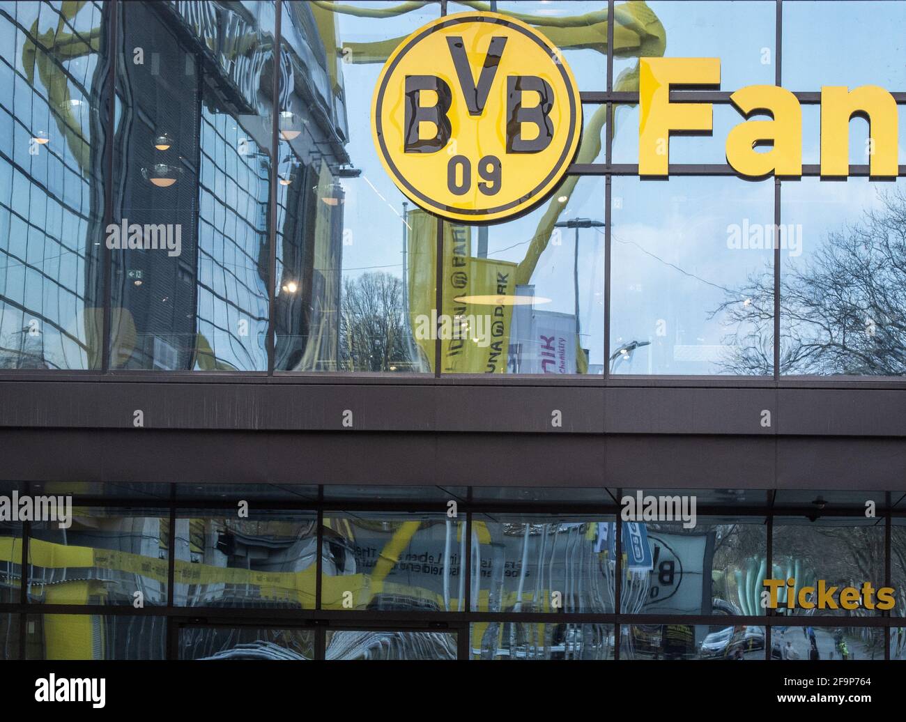 Dortmund, Germany. 20th Apr, 2021. The club logo can be seen on the façade  of the FanWelt of Bundesliga club Borussia Dortmund, which reflects the  stadium, Signal Iduna Park. According to a "