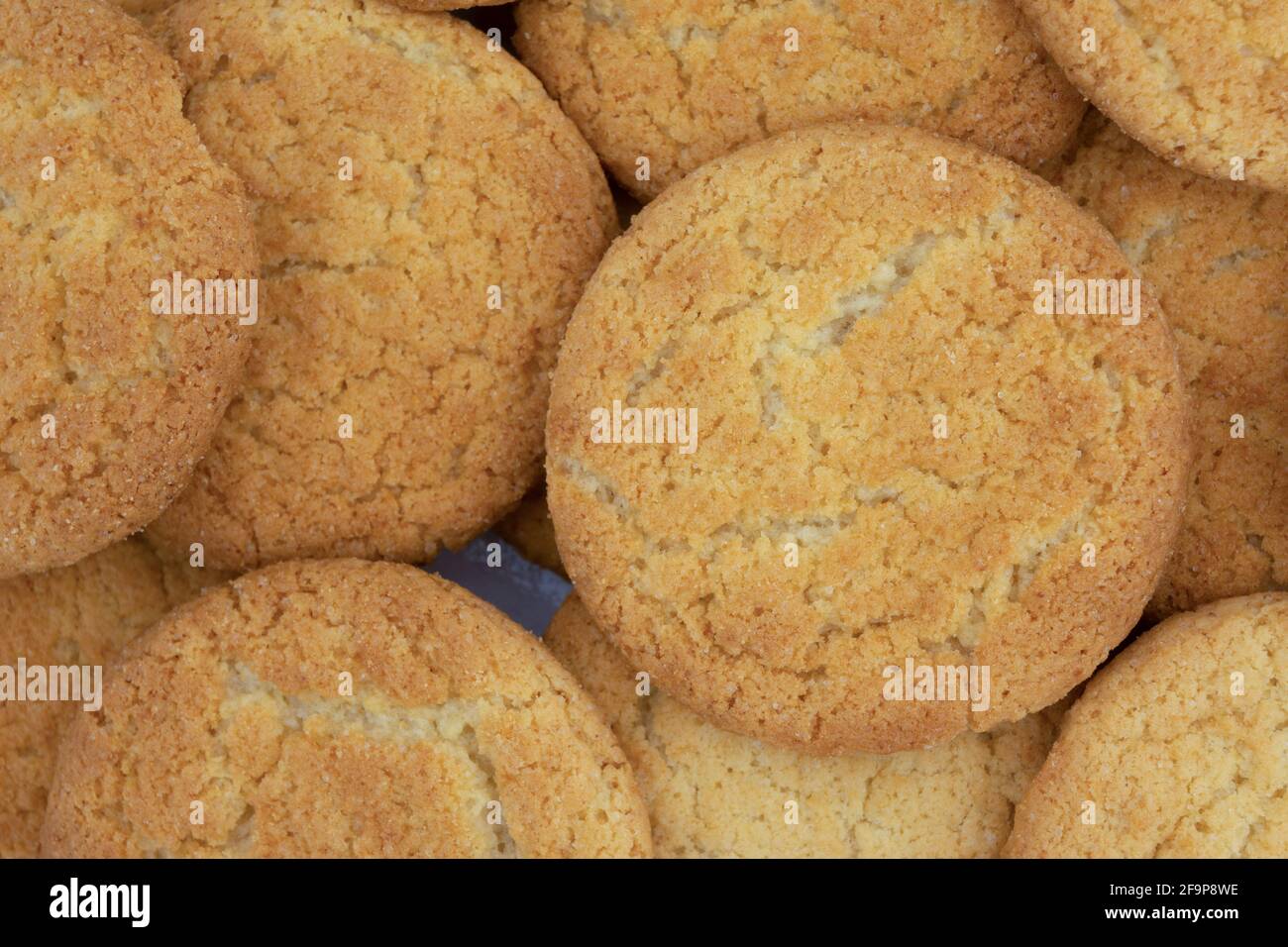 Close view of a group of coconut flavor cookies on a plate. Stock Photo