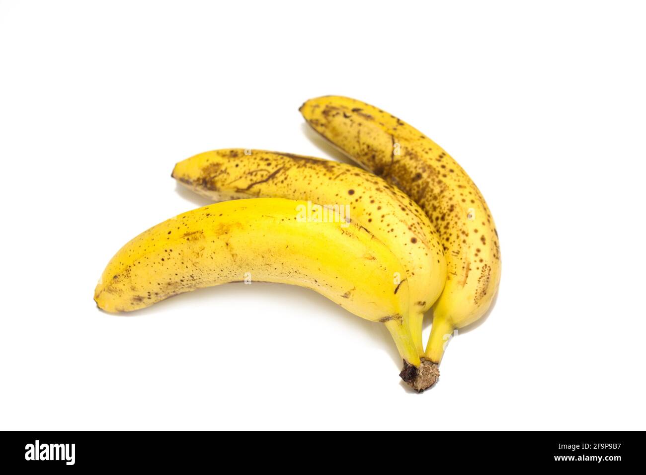 A bunch of bananas close-up view on white background Stock Photo - Alamy