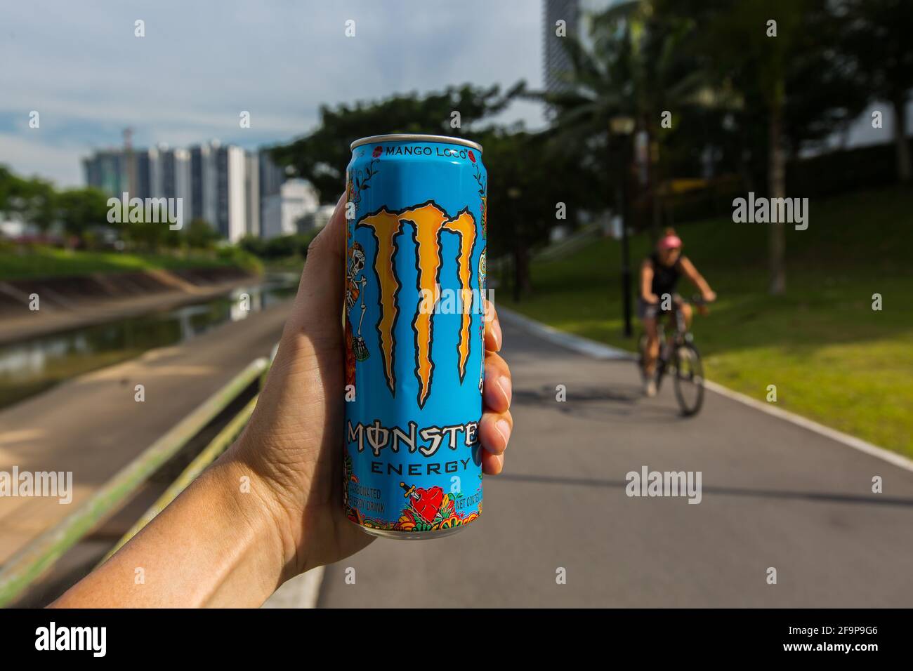 A can of Monster energy drink to fuel your energy to cycle. Stock Photo