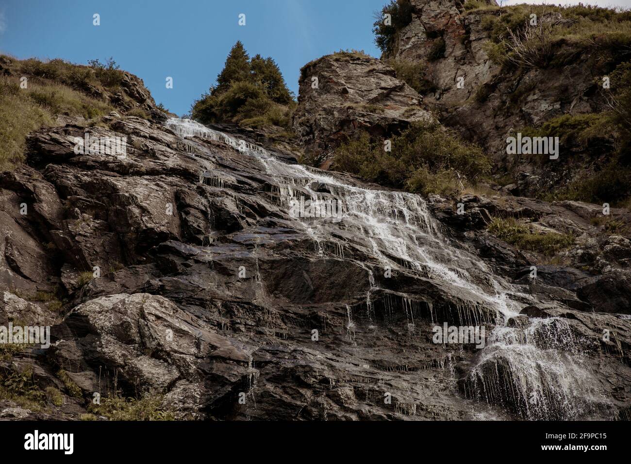 Outside Rocy Natural view of a waterfall on a rocky mountain in the countryside ...