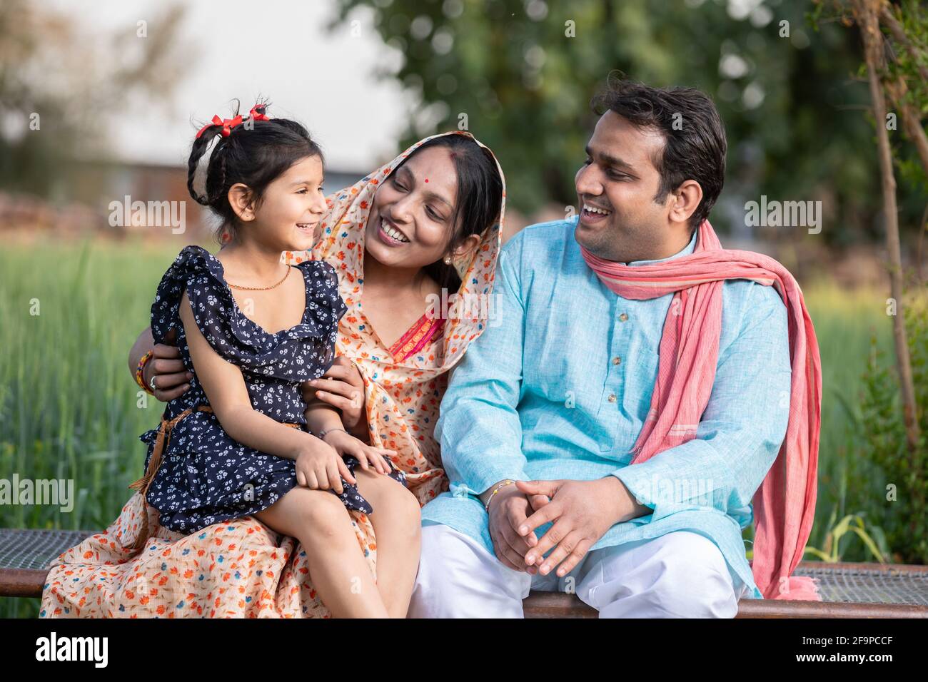 Happy Indian farmer family at agricultural field in village, Young ...