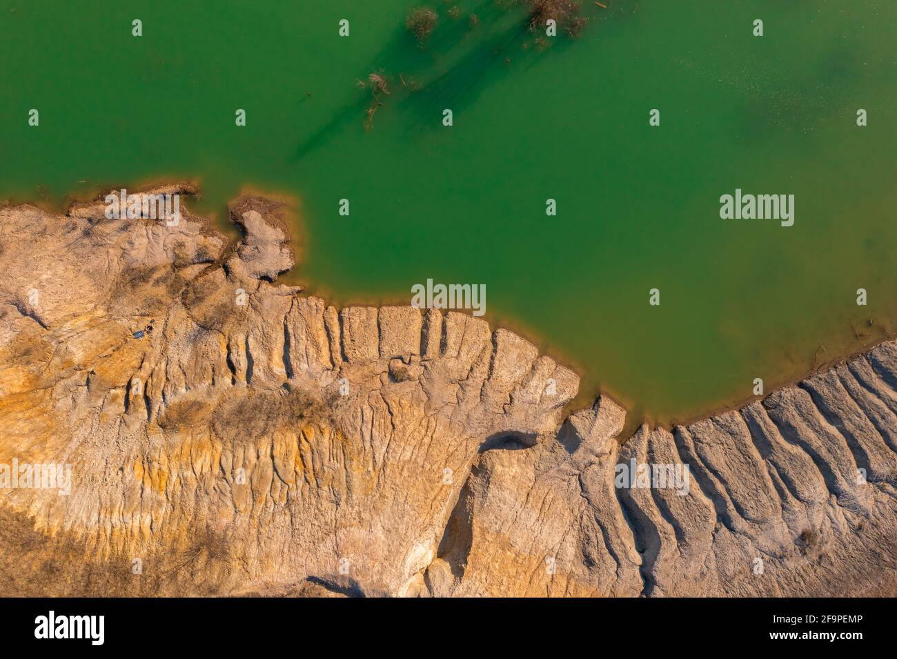 Solymár, Hungary - Aerial view about rocky seashore with green colored water. Stock Photo