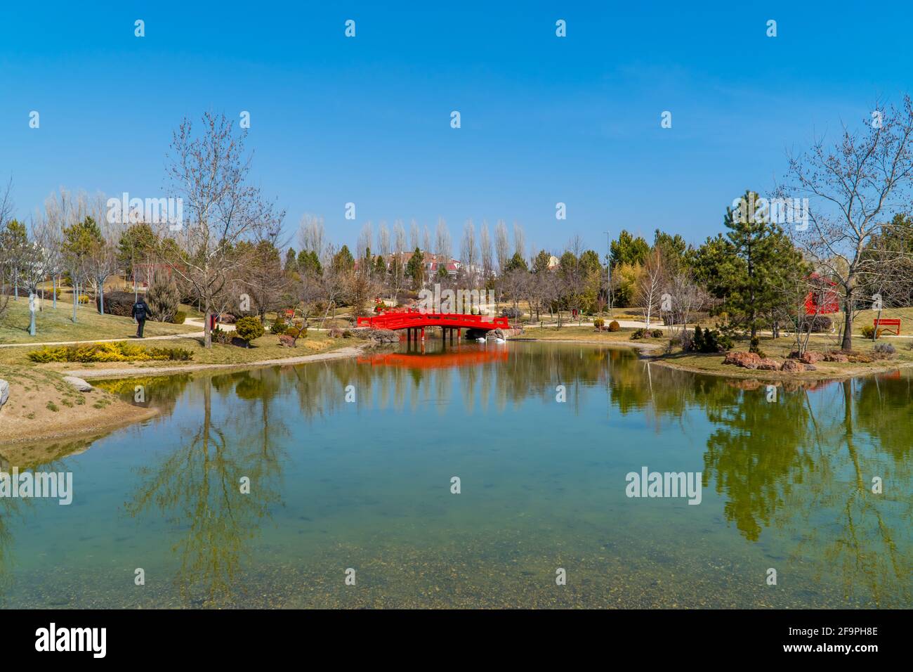 Panoramic view of the Oriental Japanese Garden with a typical red bridge inside the Municipal Zoo of Eskisehir, Turkey Stock Photo