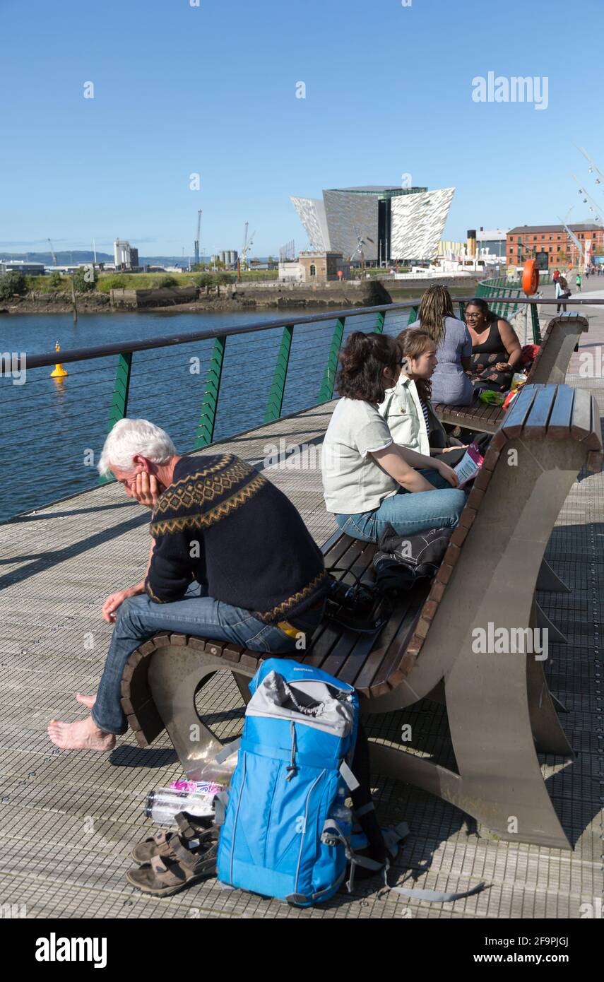 14.07.2019, Belfast, Northern Ireland, United Kingdom - Tourists in the Titanic Quarter, behind Titanic House, where the famous ship was launched in 1 Stock Photo