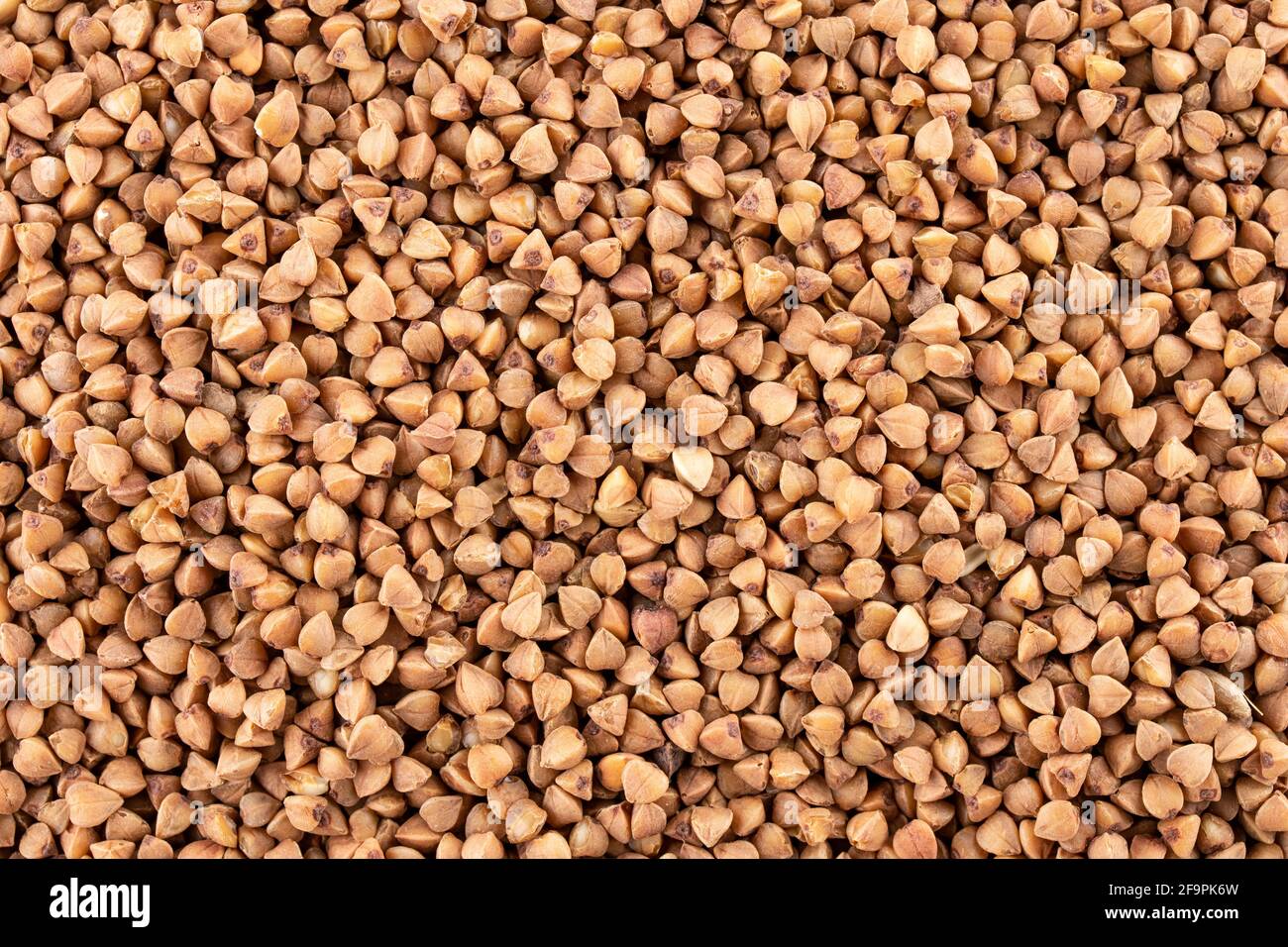 Buckwheat groats, texture background, top view, a pile of grain. Heap