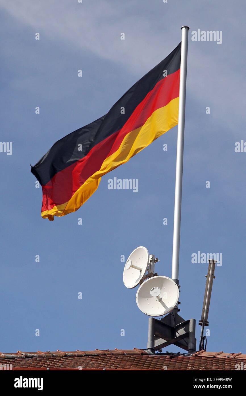 01.09.2018, Iffezheim, Baden-Wuerttemberg, Germany - Germany, national flag of the Federal Republic of Germany and satellite paddles. 00S180901D515CAR Stock Photo