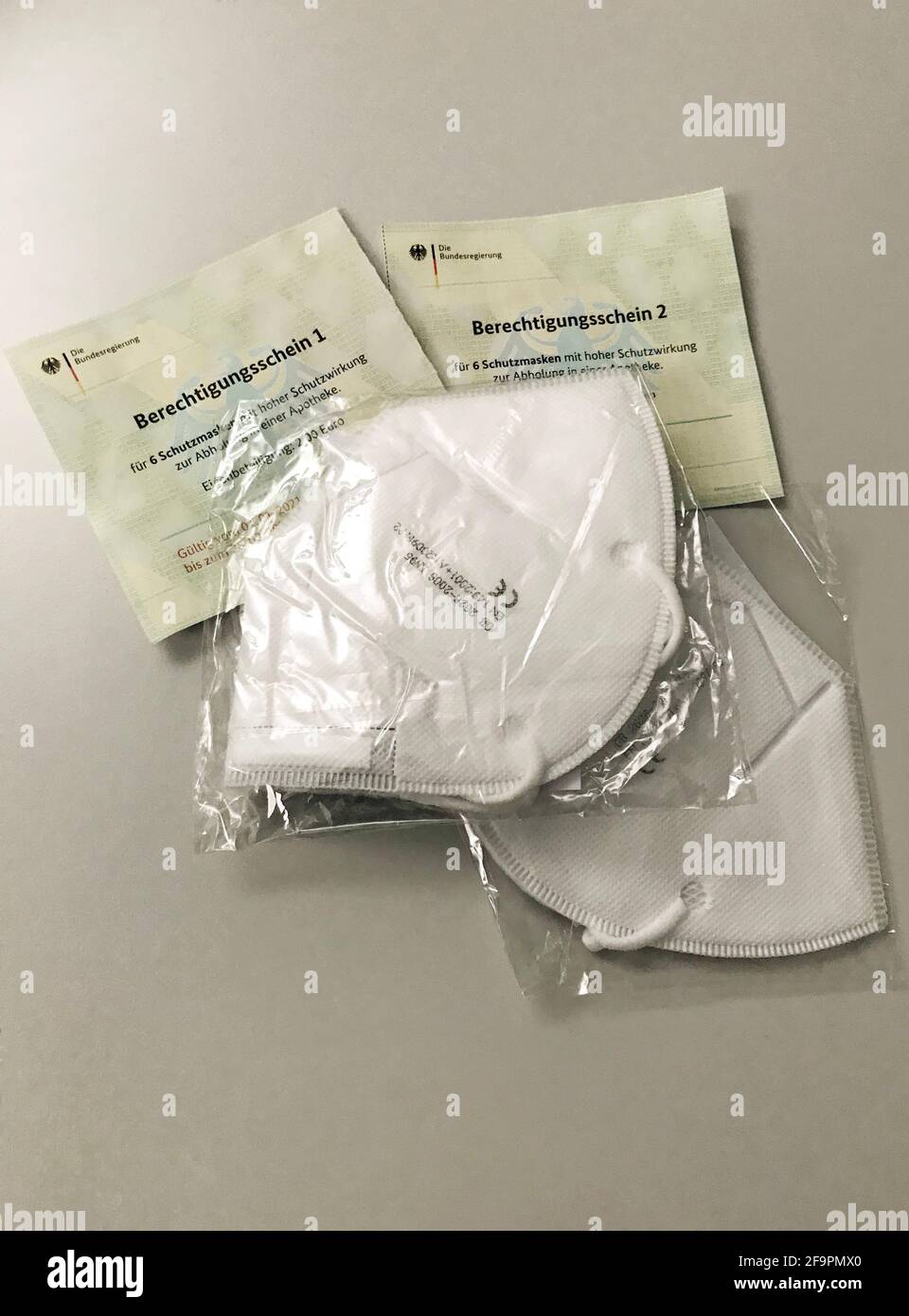 26.01.2021, Berlin, , Germany - FFP2 masks are on authorization slips from the federal government for picking up protective masks at the pharmacy. 00S Stock Photo