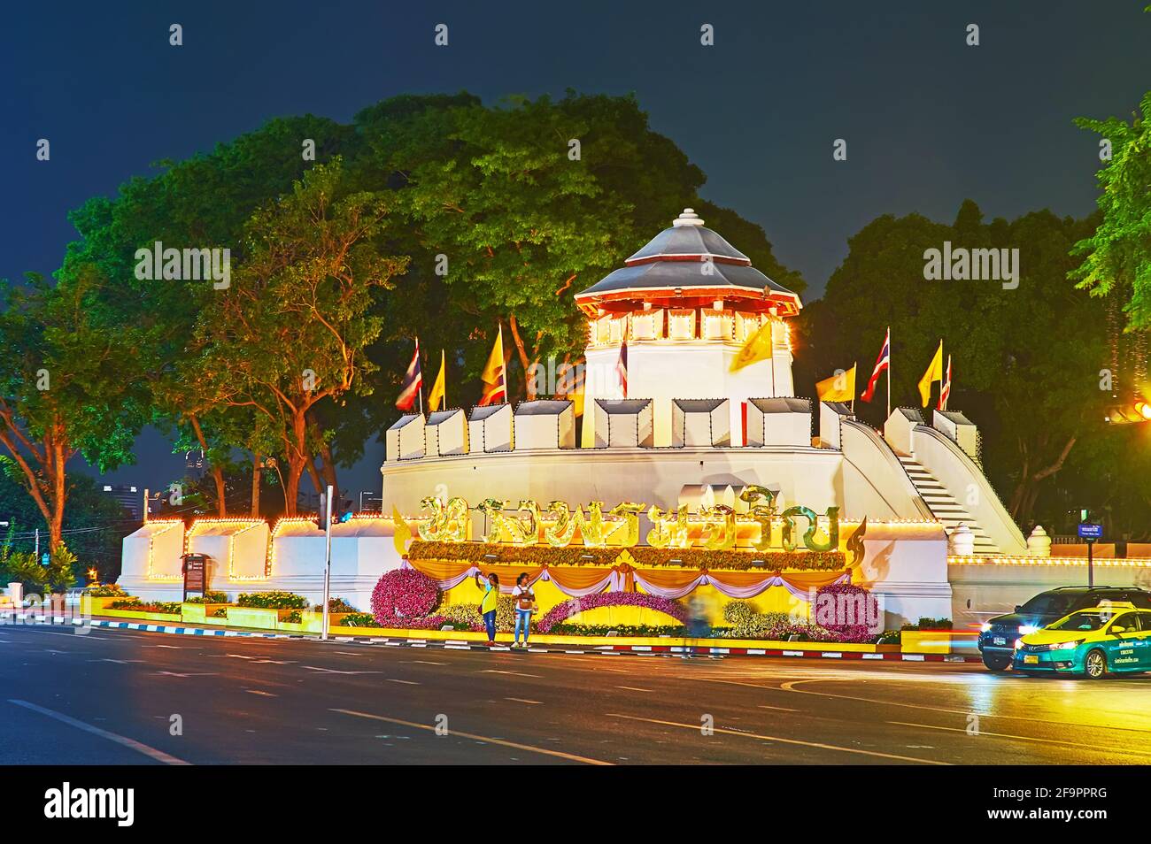 BANGKOK, THAILAND - MAY 11, 2019: Historic Phra Sumen Fort in bright evening lights, decorated with flags and flowers, Banglamphu district, on May 11 Stock Photo