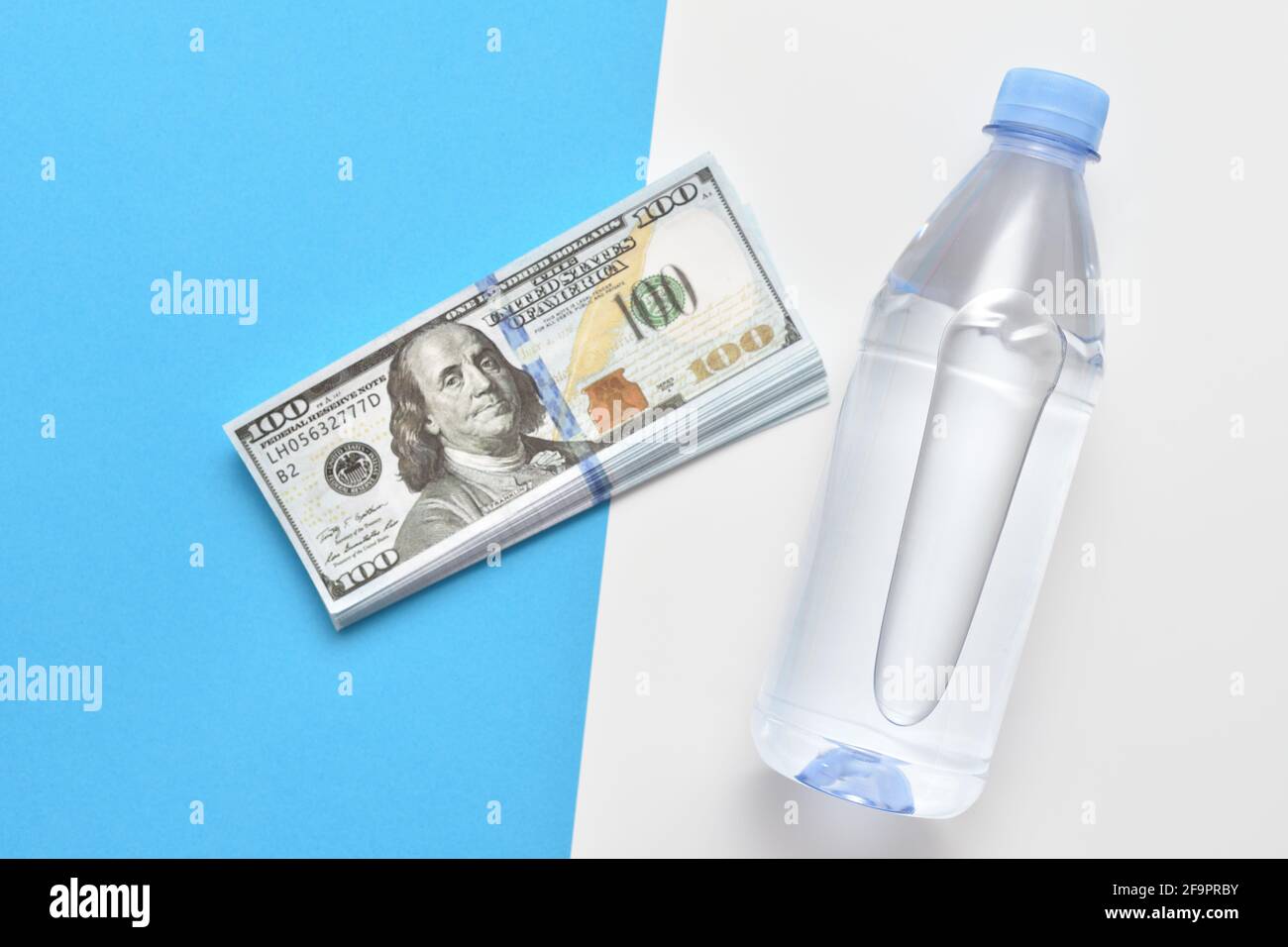 Water bottle and dollar bills Stock Photo Alamy
